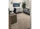 Inviting home office space with ample desk space, a futon, and large windows at 4040 E Caitlin Dr, San Tan Valley, AZ 85140