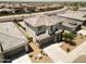 Beautiful aerial view of a house with a well-manicured yard, tile roof, and convenient driveway at 40927 W Sunland Dr, Maricopa, AZ 85138