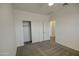 Bedroom features neutral paint, a ceiling fan, and closet at 40927 W Sunland Dr, Maricopa, AZ 85138