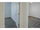 Clean bedroom featuring neutral paint, carpet, and white doors at 40927 W Sunland Dr, Maricopa, AZ 85138