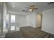Bonus room features recessed lighting, white railing and a ceiling fan at 40927 W Sunland Dr, Maricopa, AZ 85138