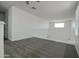 Bright bonus room features neutral carpeting and white railing and trim at 40927 W Sunland Dr, Maricopa, AZ 85138
