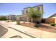 Charming two-story home with a well-manicured front yard and a two-car garage at 40927 W Sunland Dr, Maricopa, AZ 85138