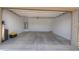 Spacious two-car garage with ample storage space, ready for your vehicles and projects at 40927 W Sunland Dr, Maricopa, AZ 85138
