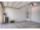 Clean, organized two-car garage with a water heater and utility connections for added convenience at 40927 W Sunland Dr, Maricopa, AZ 85138