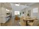 Bright and airy living space with an open layout, featuring a modern kitchen, dining area, and comfortable living room at 40927 W Sunland Dr, Maricopa, AZ 85138