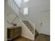 Inviting staircase with white railings, carpeted steps, and stylish decor at 40927 W Sunland Dr, Maricopa, AZ 85138