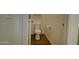 Neat half bathroom with tile floors, a comfort height toilet and crisp, bright paint at 40927 W Sunland Dr, Maricopa, AZ 85138