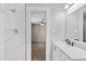 Bathroom with a single vanity, shower, and view to bedroom at 4154 W Morten Ave, Phoenix, AZ 85051