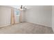 Bedroom with carpet, a window, neutral walls, and ceiling fan at 4154 W Morten Ave, Phoenix, AZ 85051