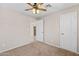 Bedroom with carpet, ceiling fan, and access to other rooms at 4154 W Morten Ave, Phoenix, AZ 85051