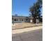Charming single-story home with a well-maintained front yard and mature tree providing shade at 4154 W Morten Ave, Phoenix, AZ 85051
