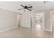 Living room with tile floors and archway to dining area at 4154 W Morten Ave, Phoenix, AZ 85051