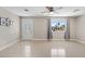 Bright living room features tile flooring, large window with natural light, and an open layout for a welcoming atmosphere at 4154 W Morten Ave, Phoenix, AZ 85051