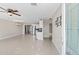 Open-concept living space showcasing tile floors, an inviting view into the kitchen, and ample natural light, promoting spacious living at 4154 W Morten Ave, Phoenix, AZ 85051