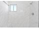 White tiled shower with window and modern fixtures at 4154 W Morten Ave, Phoenix, AZ 85051
