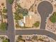 An aerial view of a home with a private pool and well-manicured landscaping within a desert neighborhood at 4402 E Barwick Dr, Cave Creek, AZ 85331