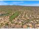 An aerial view of a beautiful desert community with meticulously landscaped properties and a well-maintained golf course at 4402 E Barwick Dr, Cave Creek, AZ 85331