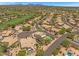 Panoramic aerial shot of desert neighborhood featuring verdant golf course and beautiful residences at 4402 E Barwick Dr, Cave Creek, AZ 85331
