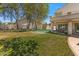 Lush backyard with mature trees, manicured lawn, and putting green at 4402 E Barwick Dr, Cave Creek, AZ 85331