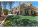 Large backyard features artificial turf, trampoline, basketball court, and patio at 4402 E Barwick Dr, Cave Creek, AZ 85331