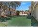 Spacious backyard featuring a basketball court, trampoline, and artificial grass at 4402 E Barwick Dr, Cave Creek, AZ 85331