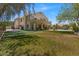 Expansive backyard with lush lawn, putting green, basketball court, and pool at 4402 E Barwick Dr, Cave Creek, AZ 85331