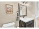 Bright bathroom featuring a modern vanity with sleek faucet and a decorative print at 4402 E Barwick Dr, Cave Creek, AZ 85331