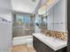 Bathroom with double vanity, decorative backsplash, and a glass shower at 4402 E Barwick Dr, Cave Creek, AZ 85331