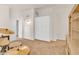 This carpeted bedroom has custom storage cabinets and access to other rooms at 4402 E Barwick Dr, Cave Creek, AZ 85331