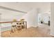 Carpeted loft features wooden railing overlooking other rooms and access to additional spaces at 4402 E Barwick Dr, Cave Creek, AZ 85331