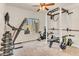 Spacious exercise room equipped with treadmill, weights, and a multi-station weight machine at 4402 E Barwick Dr, Cave Creek, AZ 85331