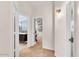 Neutral hallway with access to multiple rooms and a decorative wall sconce at 4402 E Barwick Dr, Cave Creek, AZ 85331