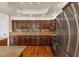 Kitchen boasting stainless steel appliances, granite counters, and custom dark-wood cabinetry at 4402 E Barwick Dr, Cave Creek, AZ 85331