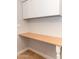 Laundry area with bright white cabinets and a long folding table at 4402 E Barwick Dr, Cave Creek, AZ 85331