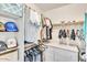 Well-organized walk-in closet with shelving, rods, and built-in storage at 4402 E Barwick Dr, Cave Creek, AZ 85331