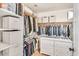 Organized walk-in closet with built-in shelving, drawers, and ample hanging space at 4402 E Barwick Dr, Cave Creek, AZ 85331
