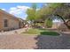 Well-maintained backyard with a pergola, ample space for outdoor activities, and desert landscaping at 4667 E County Down Dr, Chandler, AZ 85249