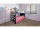 Cozy bedroom featuring a space-saving bunk bed and a stylish floor lamp at 4667 E County Down Dr, Chandler, AZ 85249