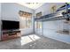 Bright bedroom with a modern loft bed, large window, and entertainment center at 4667 E County Down Dr, Chandler, AZ 85249