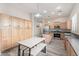 Eat-in kitchen boasts stainless appliances, center island, and lots of cabinets for storage at 4667 E County Down Dr, Chandler, AZ 85249