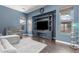 Comfortable living room showcases a built-in media center, plush seating, and a sun-drenched ambiance at 4667 E County Down Dr, Chandler, AZ 85249