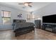 Spacious main bedroom features a ceiling fan, neutral walls, and tile flooring for comfortable living at 4667 E County Down Dr, Chandler, AZ 85249