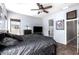 Main bedroom features a ceiling fan, neutral walls, and tile flooring for comfortable living at 4667 E County Down Dr, Chandler, AZ 85249