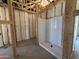 Unfinished bathroom featuring a new white shower at 46868 W Coe St, Maricopa, AZ 85139