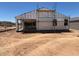 New home construction featuring scaffolding and a partial covered patio at 46868 W Coe St, Maricopa, AZ 85139