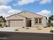 Charming single-story home with a two-car garage and low maintenance desert landscaping at 46868 W Coe St, Maricopa, AZ 85139