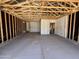 Unfinished two car garage with unfinished walls and ceiling at 46868 W Coe St, Maricopa, AZ 85139