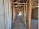 New construction interior featuring framed walls and utilities installed throughout the house at 46868 W Coe St, Maricopa, AZ 85139