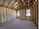 Bright living room featuring unfinished walls, ceiling, and windows at 46868 W Coe St, Maricopa, AZ 85139